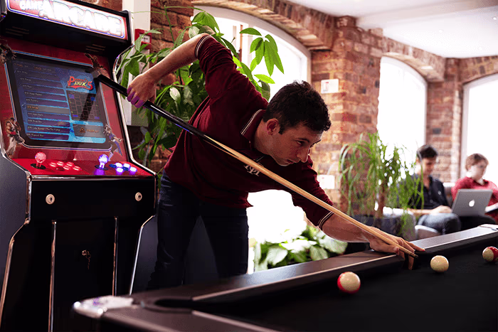 website design agency office playing pool