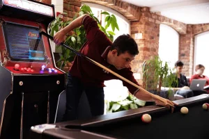 website design agency office playing pool